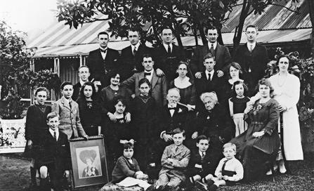 , The extended White family gather in the front garden of Don Bank Cottage for 50th wedding anniversary of James and Johanna (seated in centre) in 1919. Thomas and Catherine, who were living there, are on the far right back and middle row. Stanton Library